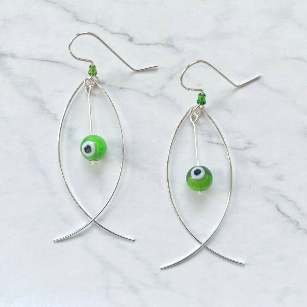 Silver Fish Earrings with Green Evil Eye Worry Bead
